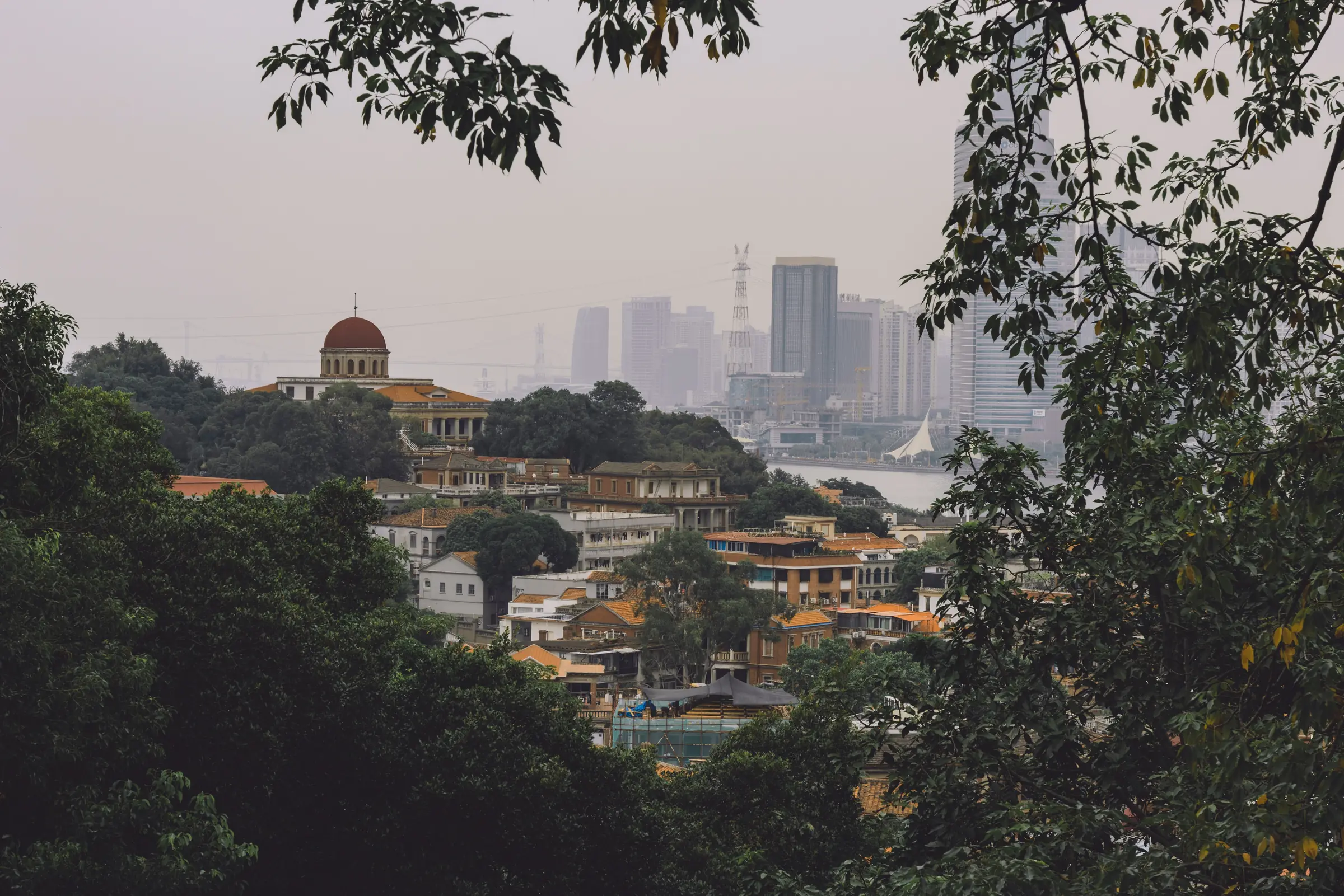 Historic Gulangyu architecture with modern Xiamen across the water
