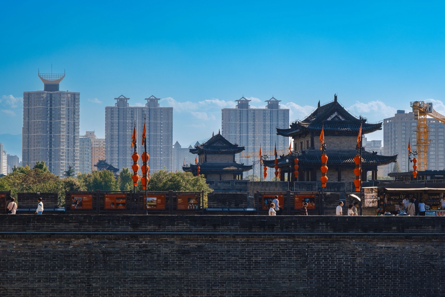 Traditional towers on Xi’an city wall with modern apartment buildings behind