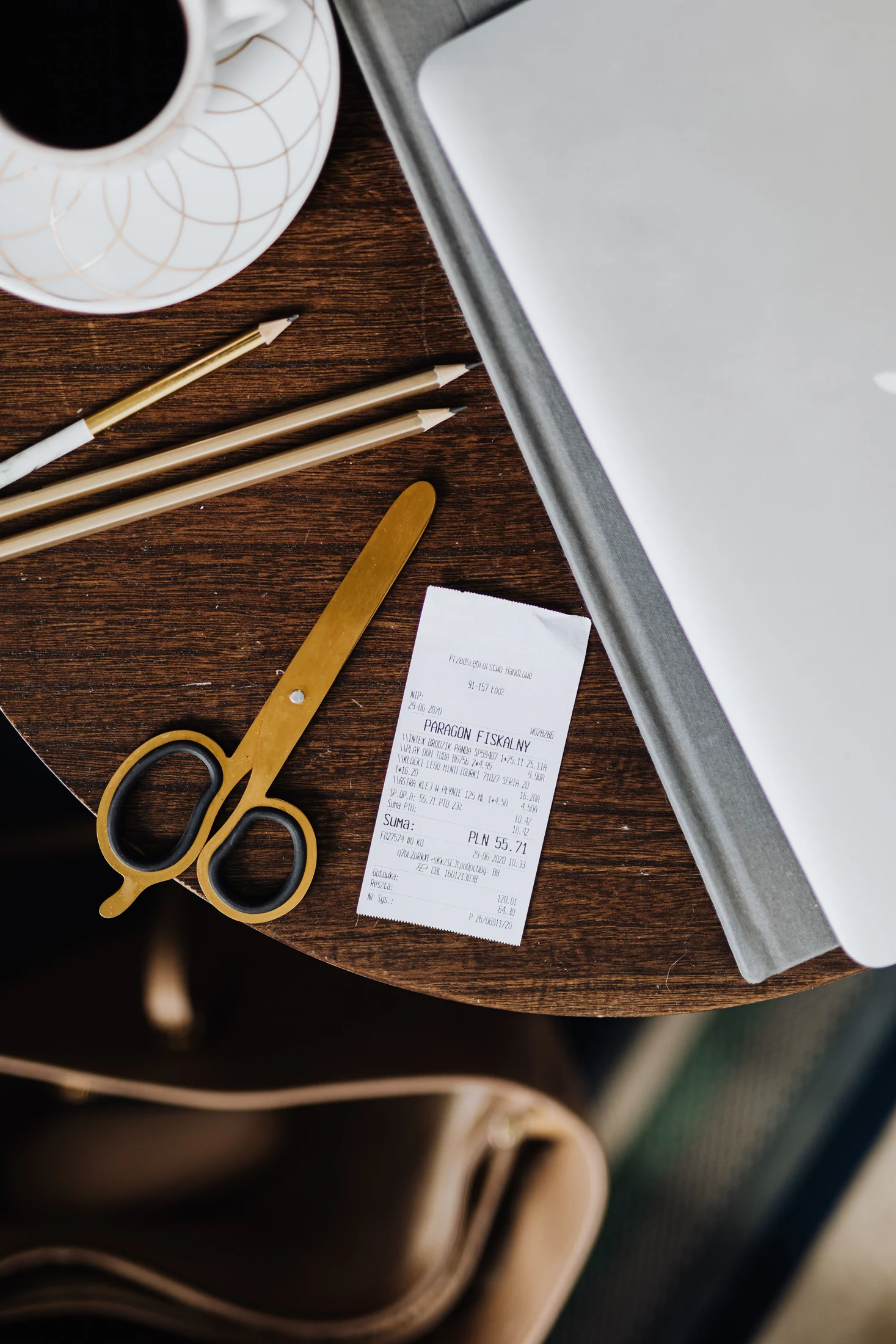 Receipt and work tools on a table